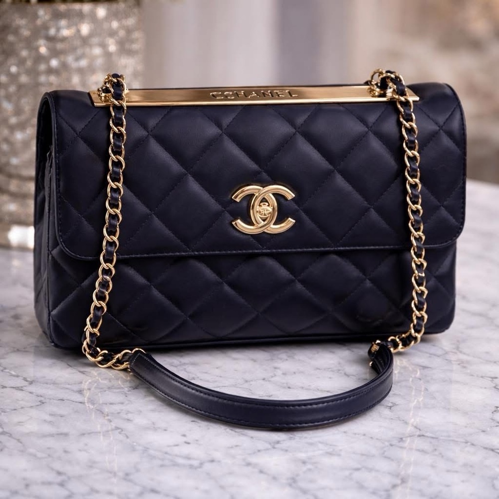 Sold Chanel Navy Quilted Shoulder Bag with Gold Accents